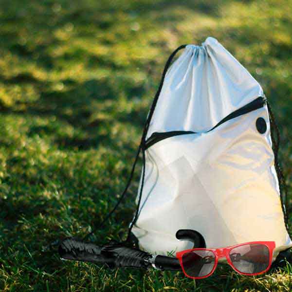 Bag, Umbrella and Sunglasses on Grass