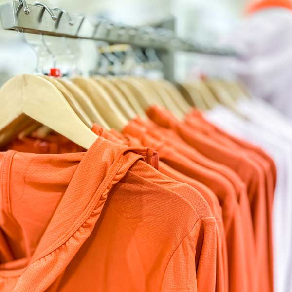 Orange Clothes Hanging On A Rail